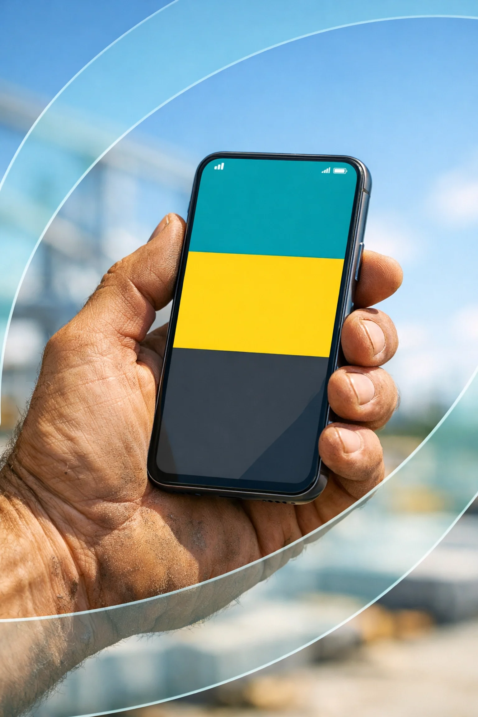 Rugged hand holding a smartphone on a job site, symbolizing mobile technology use in construction or field work.