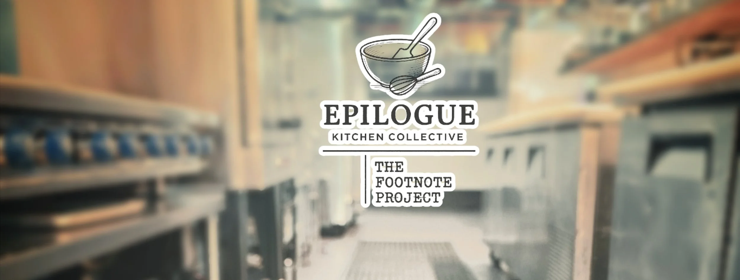 The Epilogue Kitchen Collective and The Footnote Project's logo of a mixing bowl, whisk, and spatula sit in the forefront, along with a blurred background of the working kitchen of Manuscript and Epilogue, consisting commerical cooking equipment.