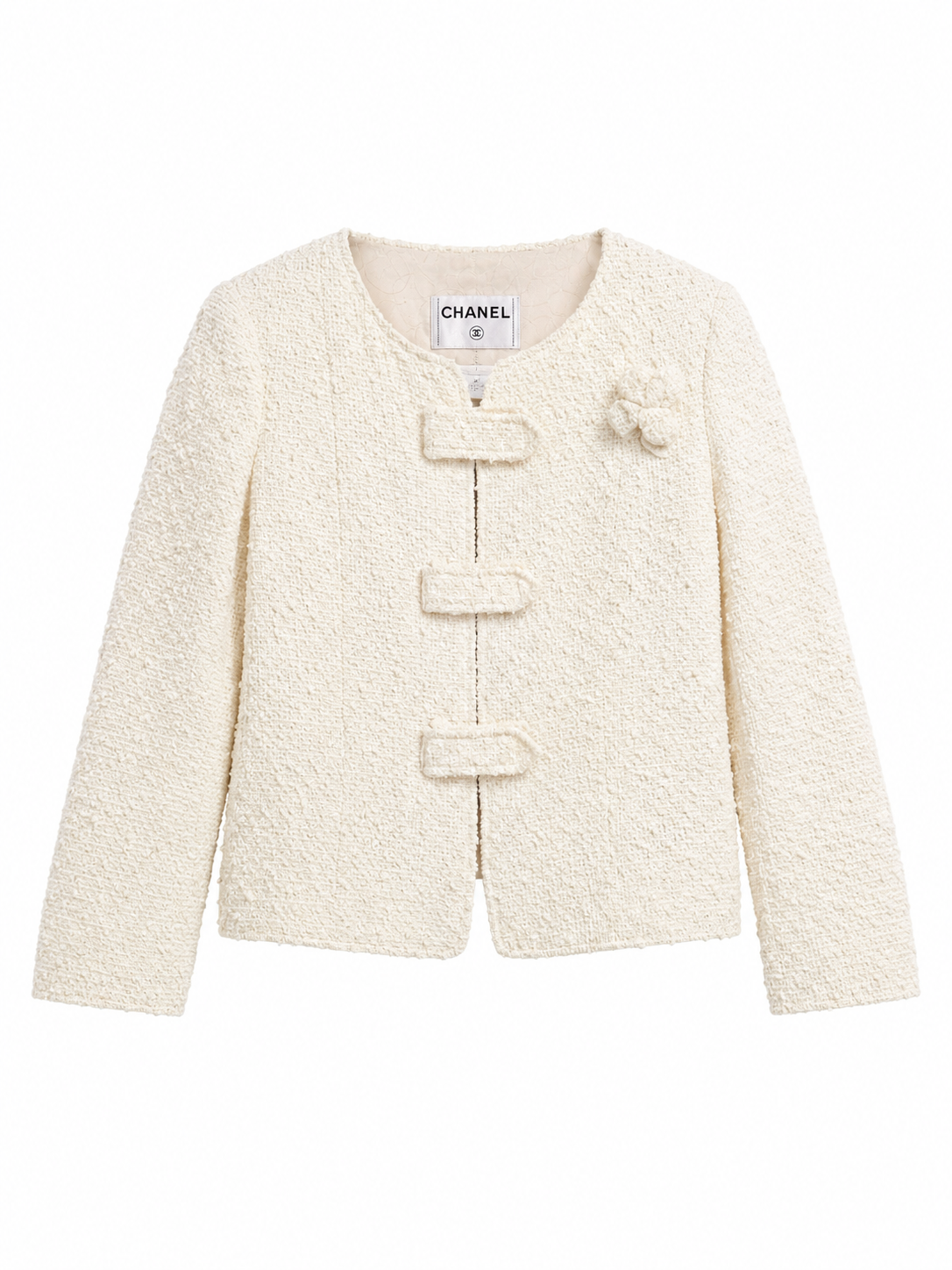 Vintage Chanel Cruise 2004 ivory bouclé jacket — collarless with knotted closures and resin CC buttons