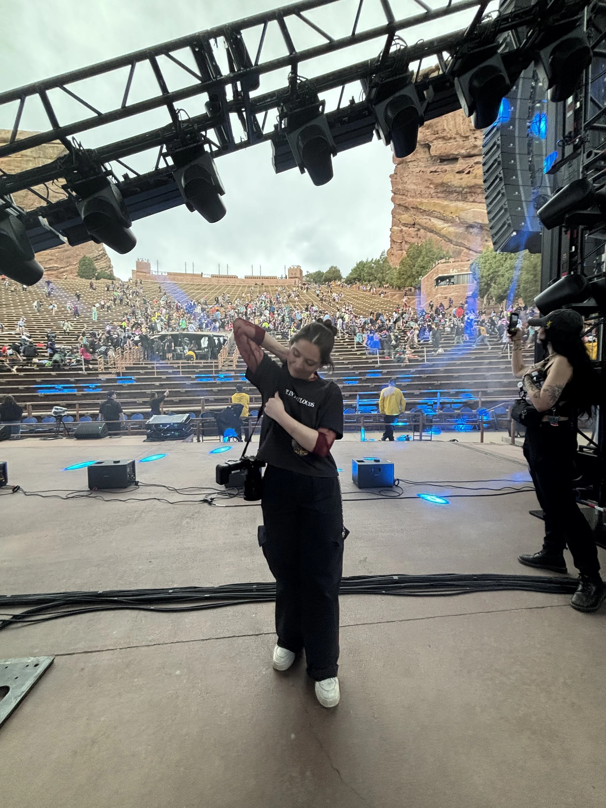 Sydney Leemhuis, Denver photographer and founder of Squid’s Ink Media on stage at Red Rocks 2026.