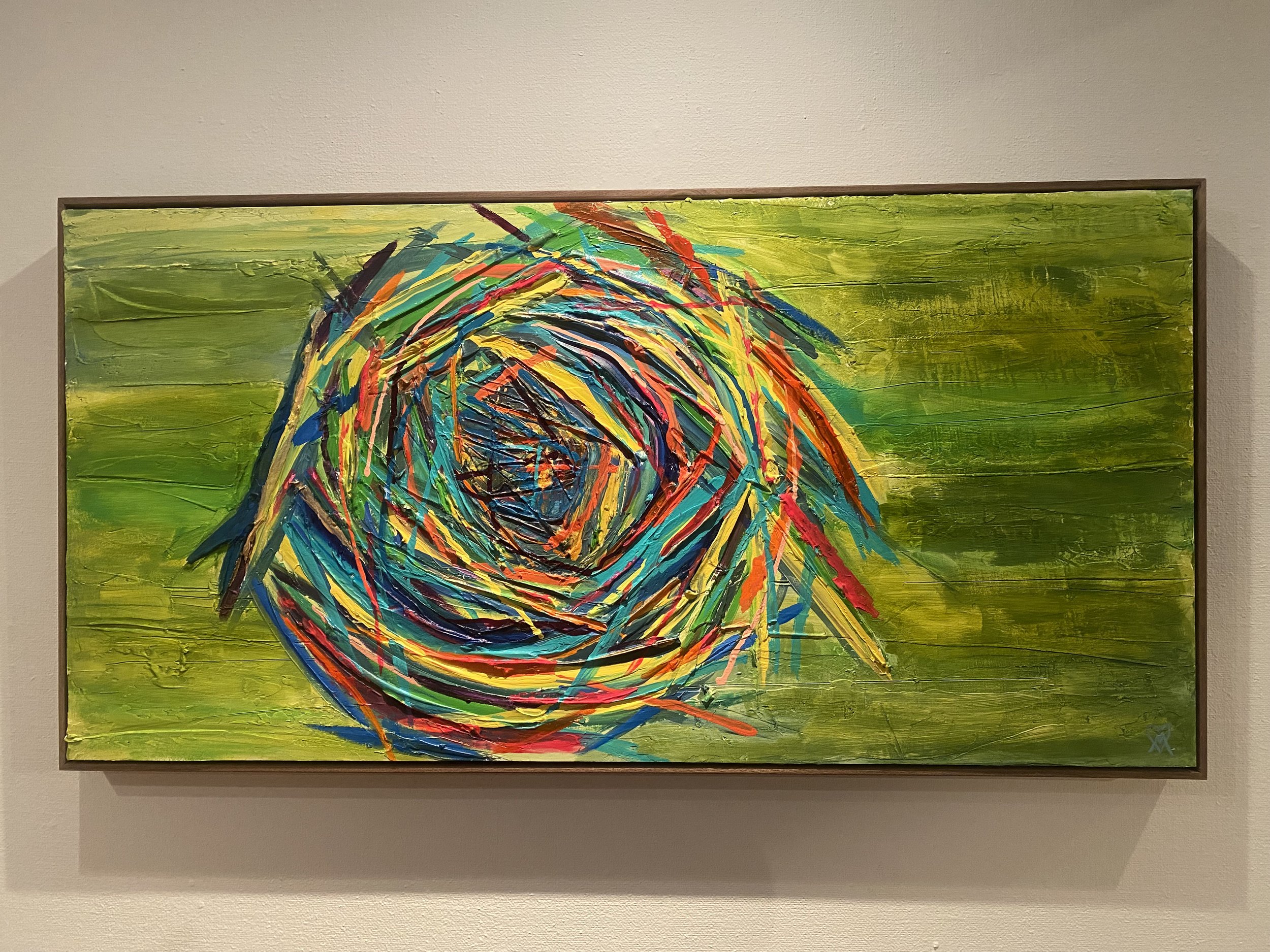 24 inch by 48 inch multicolored nest painting on a green background