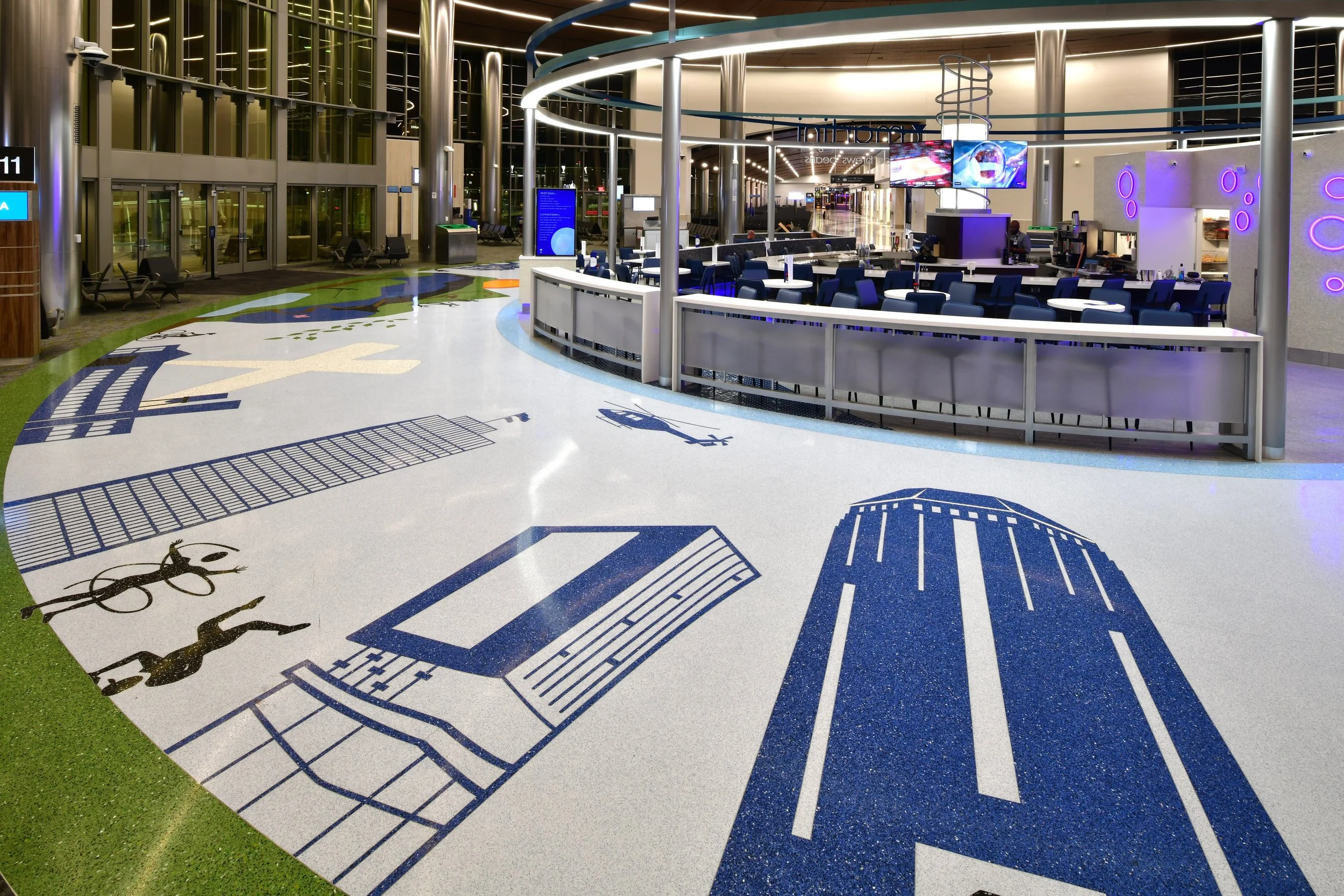 The circular node stretches 96’ in diameter around a 56’ concessionaire. The 4778 square foot design incorporates 10 colors, some of which were custom mixed just for this project. 