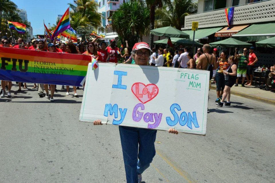 delfín's mother, marching in a pride parade.