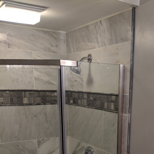 Neo-angle shower trim detail pencil tile