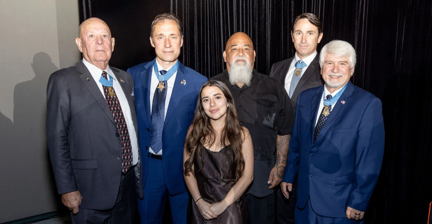 Daniel Munoz, a service-disabled U.S. Air Force veteran and Heroes Linked program assistance recipient, and his niece, Elena, meet Medal of Honor recipients at a Heroes Linked community event.