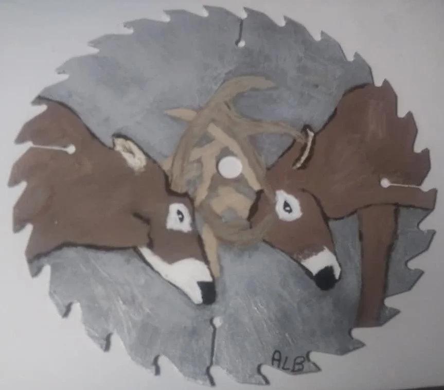Decorative saw blade featuring a painted design of three wolf heads with different fur colors.