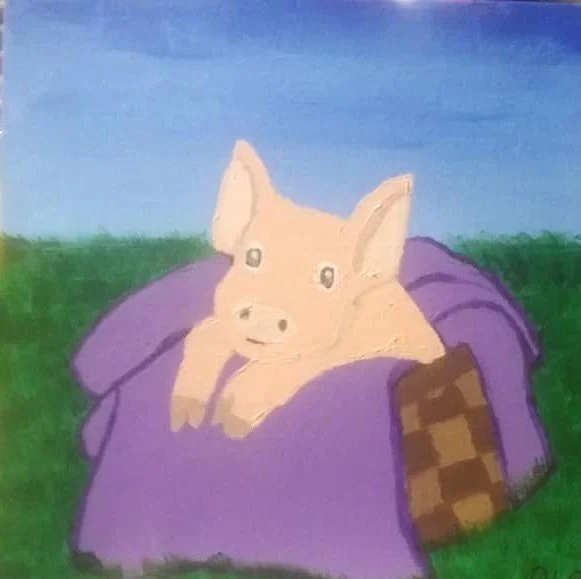 A cartoon illustration of a pig's face peeking out from under a purple blanket on a grassy field with a blue sky background.