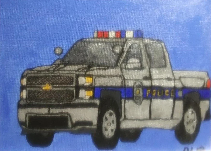 A painted police pickup truck with a blue stripe and police markings on a blue background.