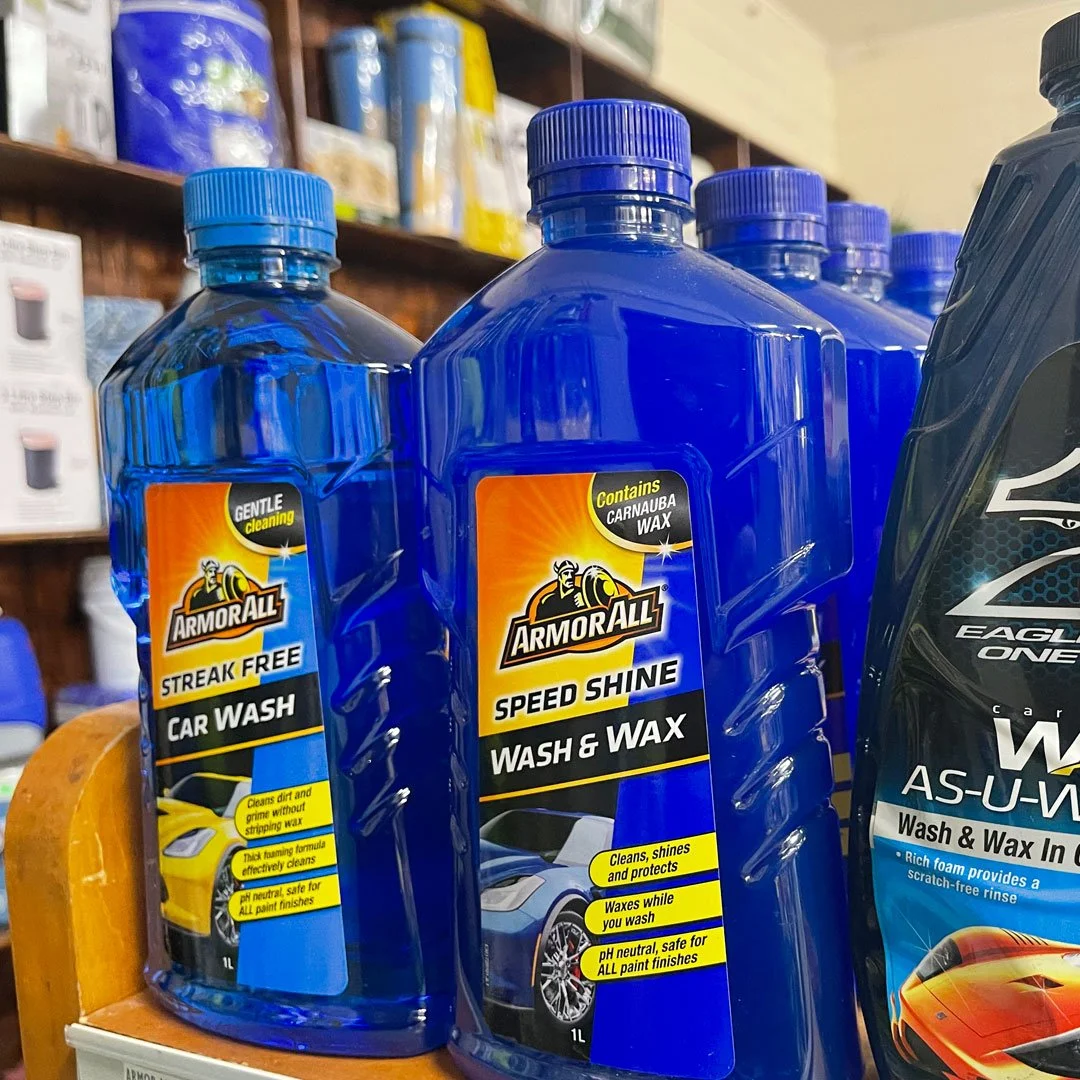 Bottles of Armor All car wash and wax products on a store shelf.