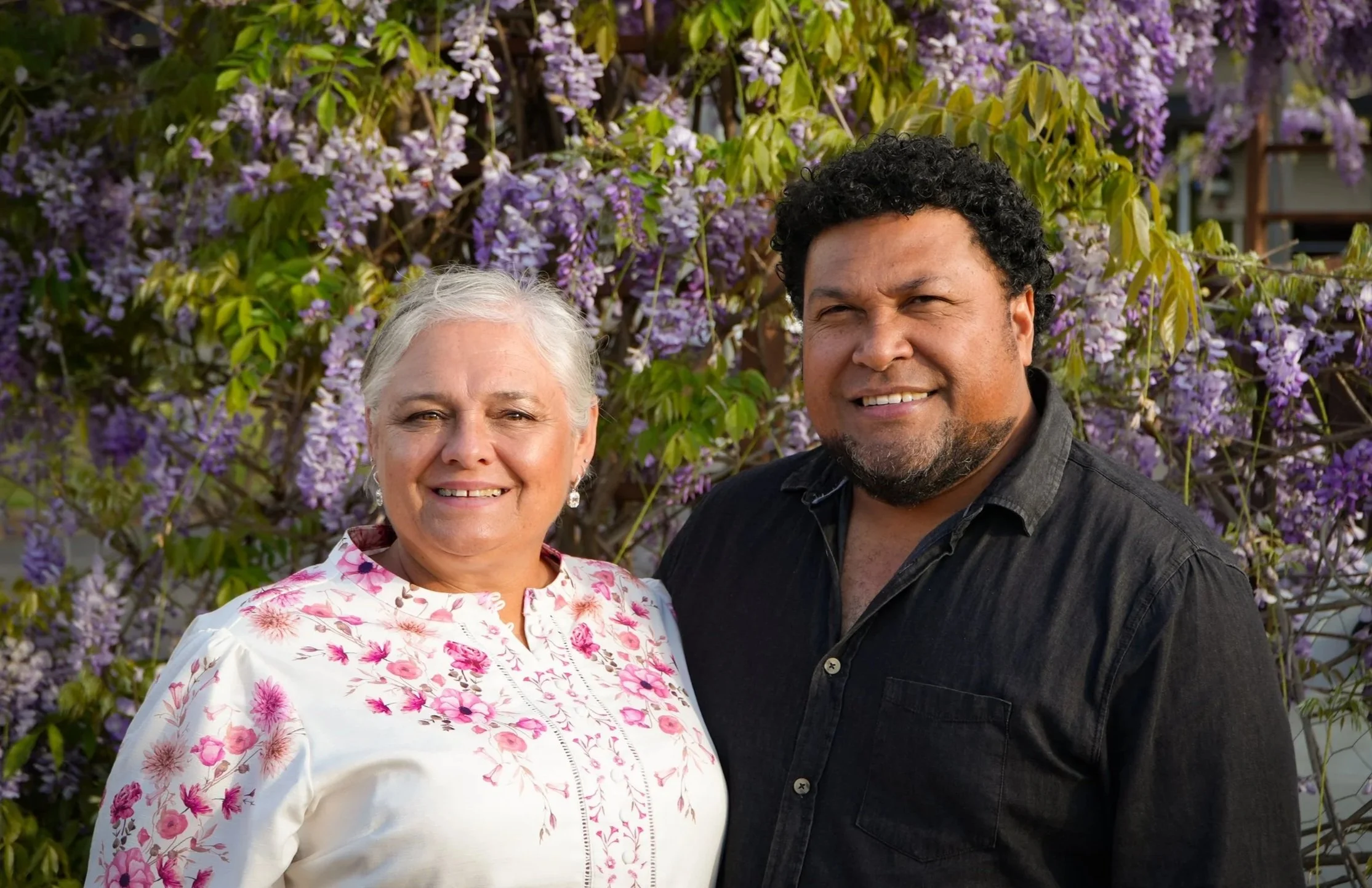 A warm,confident friendly couple, ready to help anyone that needs it