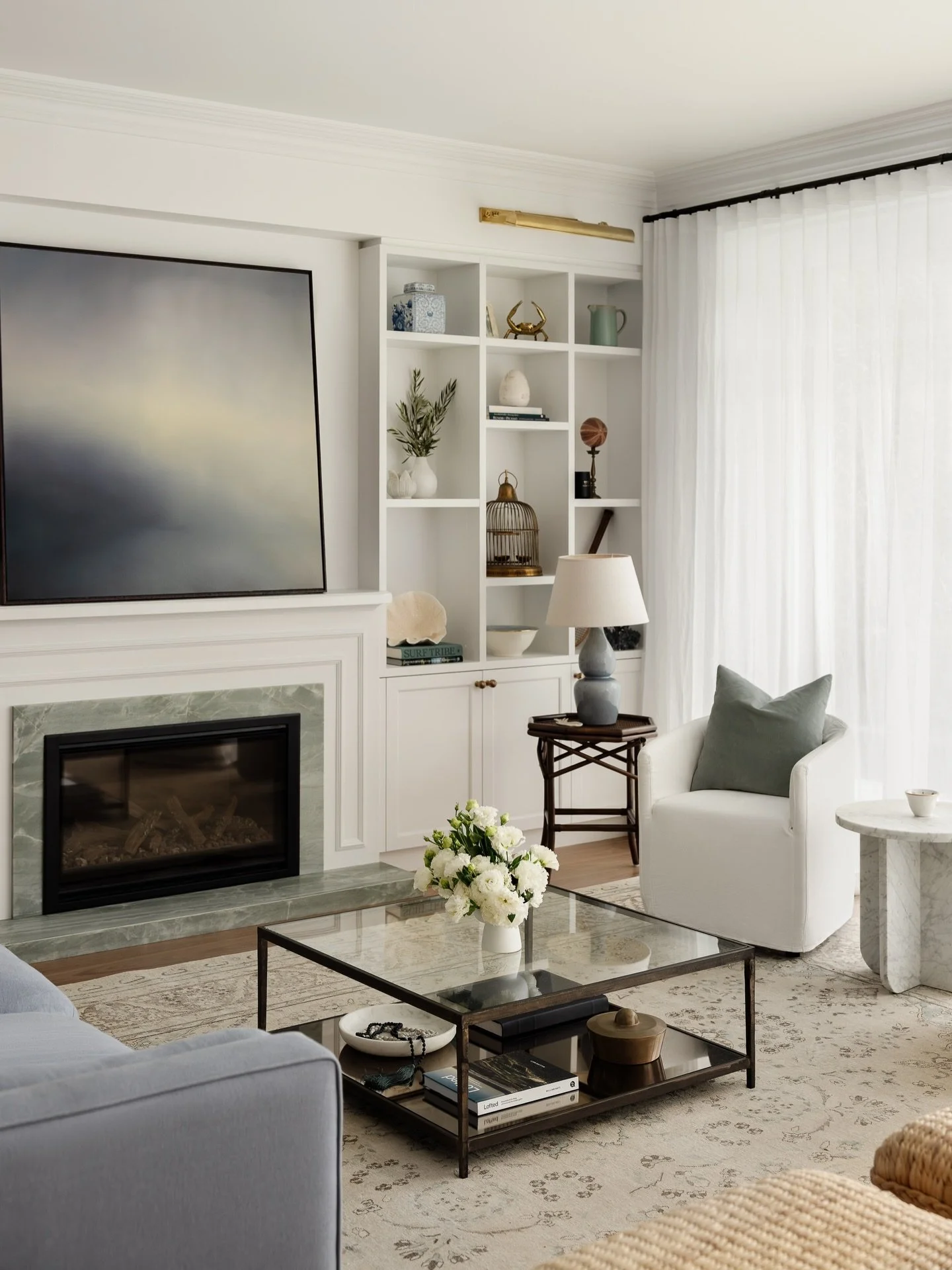 The living room at #CasaOnNoble was thoughtfully designed around the rhythms of family life. Expanded joinery provides space for books, family photos and collected objects, while generous concealed storage below keeps toys and games neatly tucked awa