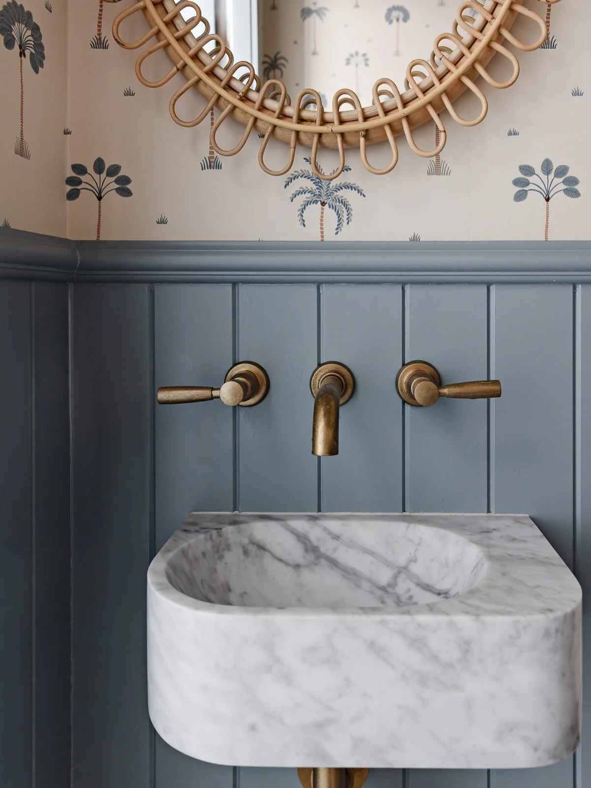 A little jewel box brimming with coastal charm.

When designing the bathroom in our studio, we embraced its compact footprint and layered in character through a palm-motif wallpaper, a sculptural marble basin and patterned tiles. 

Photography by @th