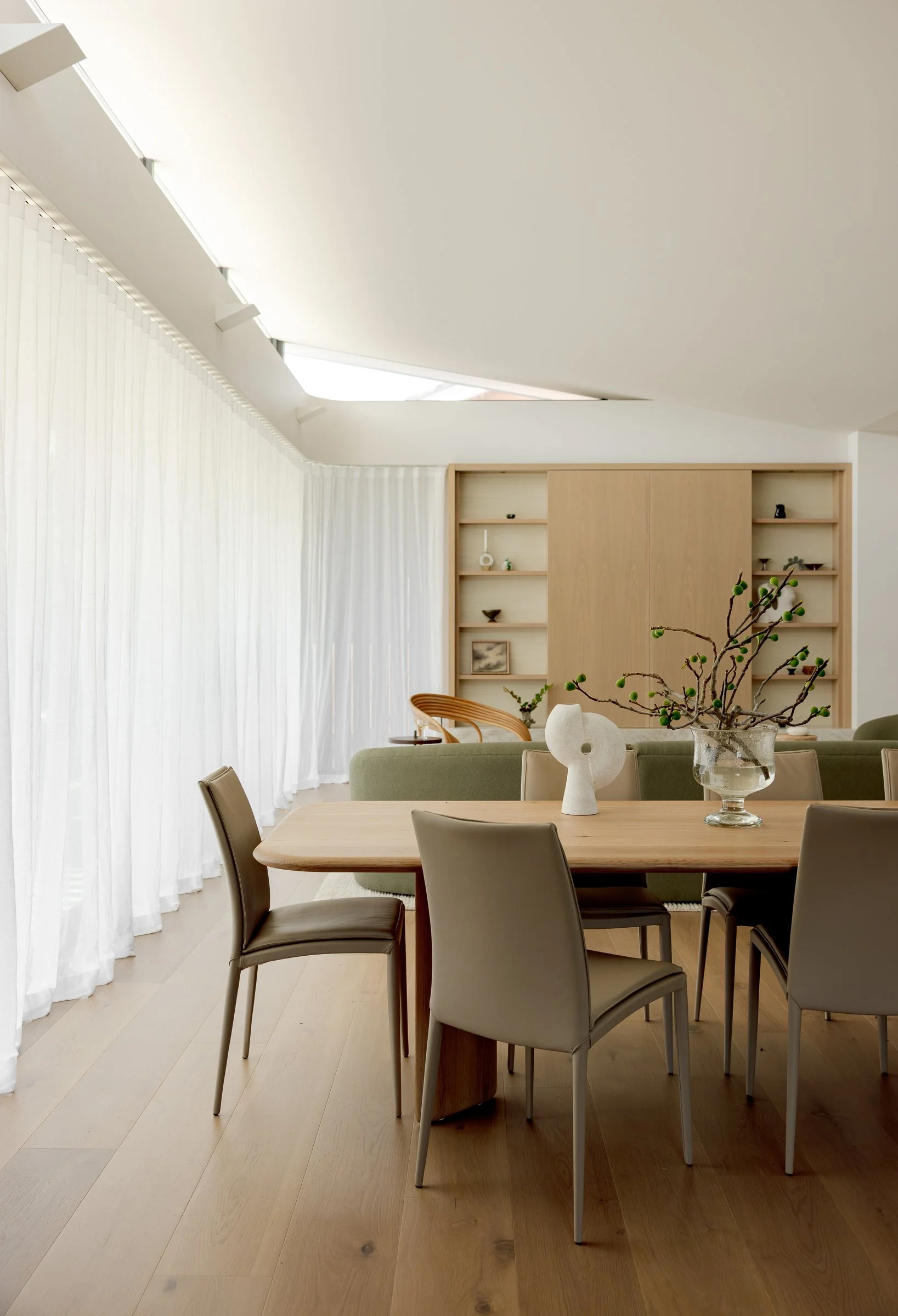 Open plan coastal living and dining room in Manly home