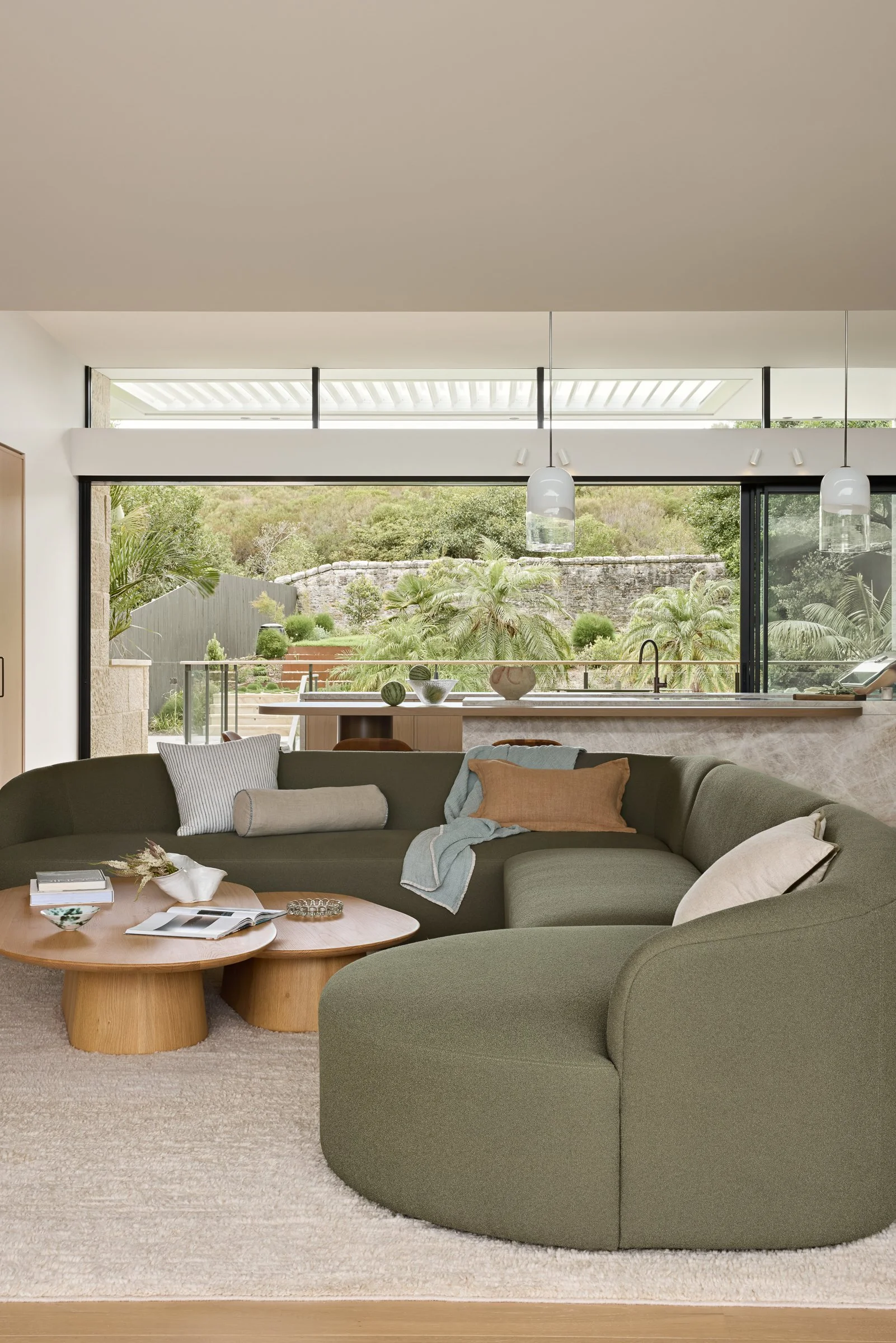 Luxury coastal living room overlooking Bower Beach by Cote Interiors