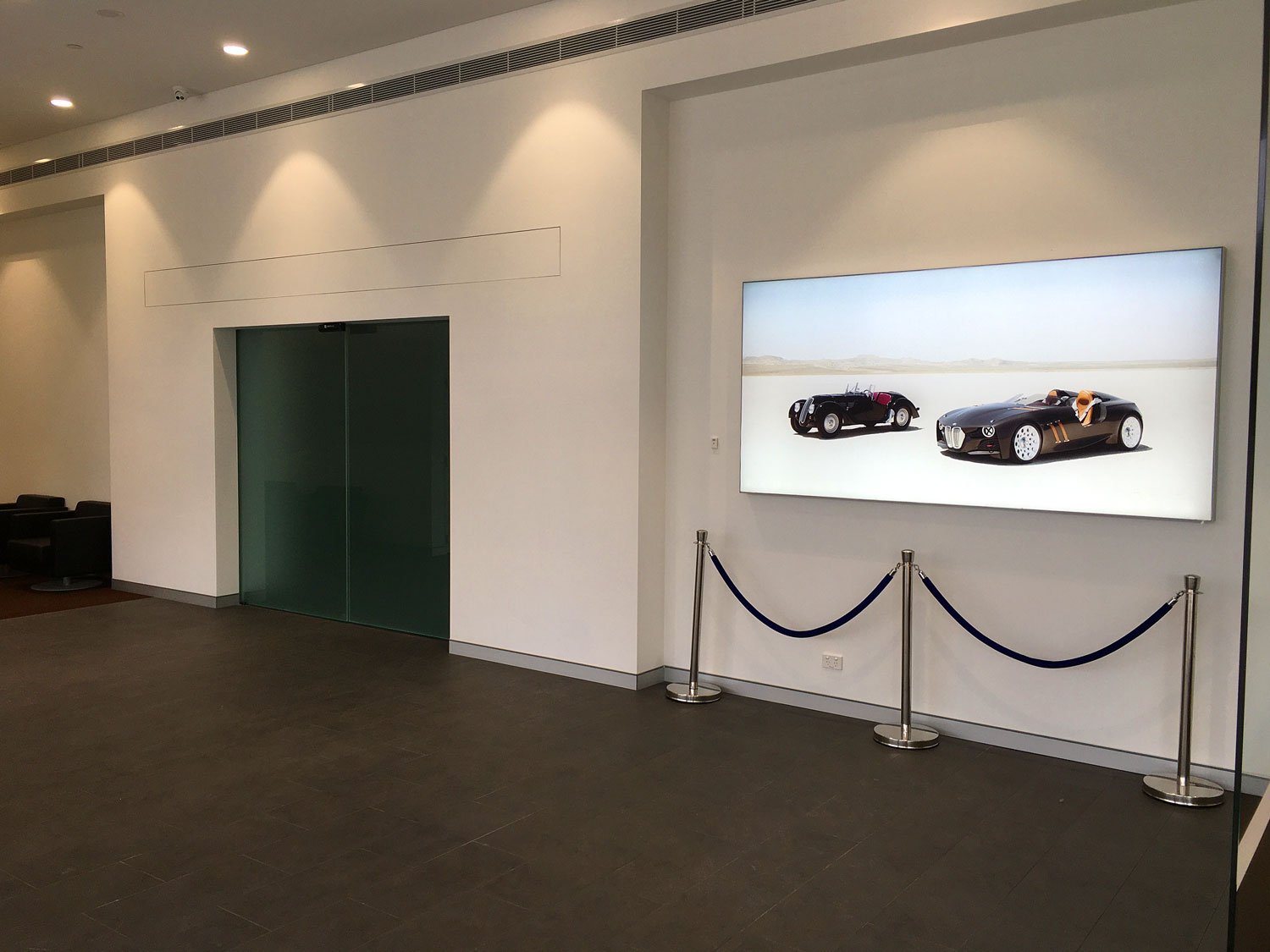  BMW Showroom car lift with glass frosted doors 