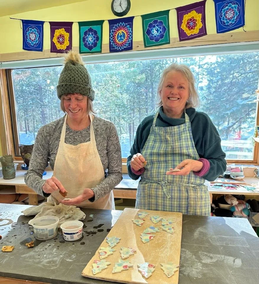 Two women making holiday cookies