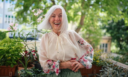 woman standing outside smiling