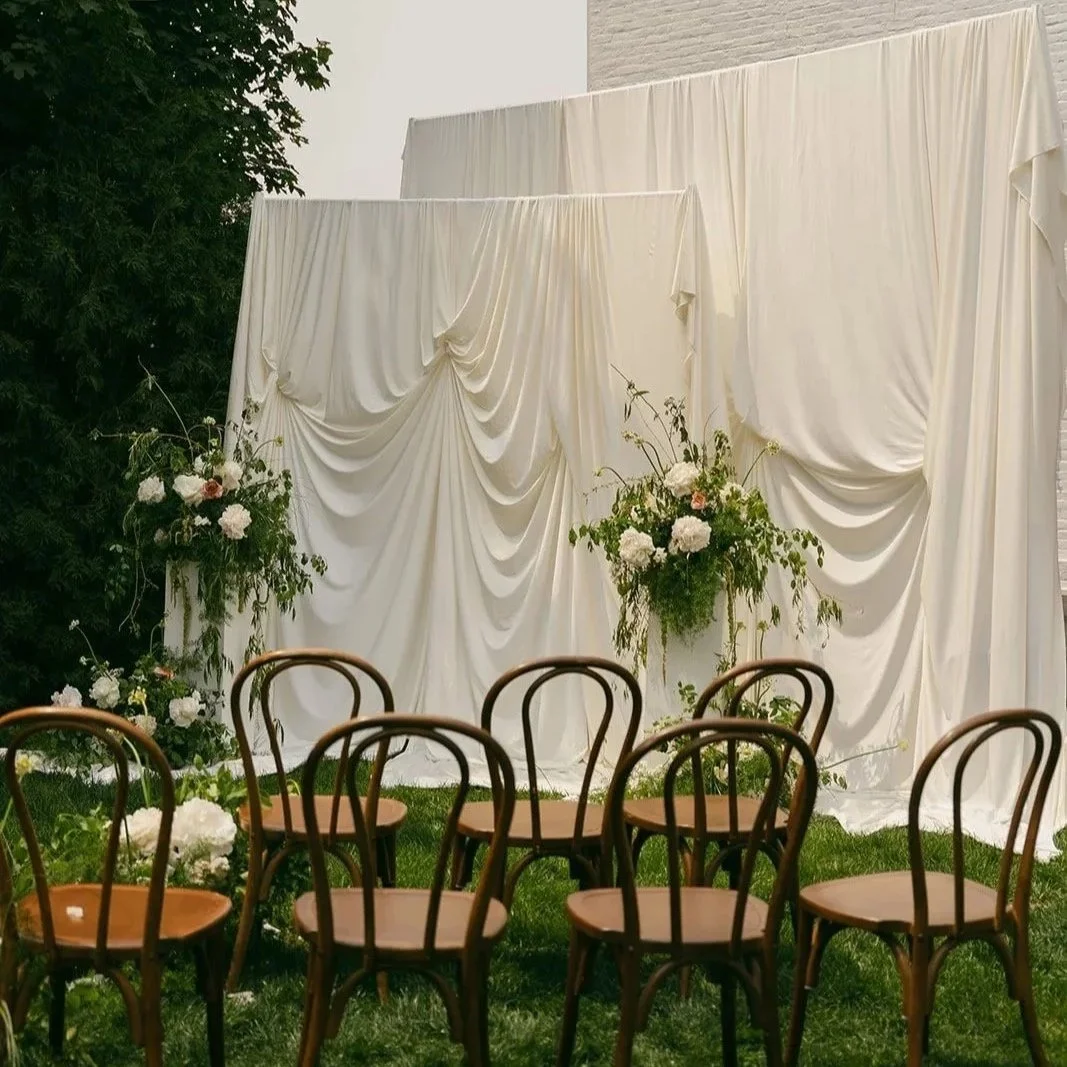 Luxury intimate micro wedding setup at a Wisconsin estate with floral décor and ceremony arch