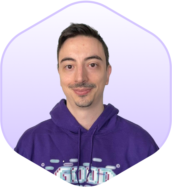 Therapist wearing a purple hoodie with a "Good Game" design, standing in front of a digital, blocky background.