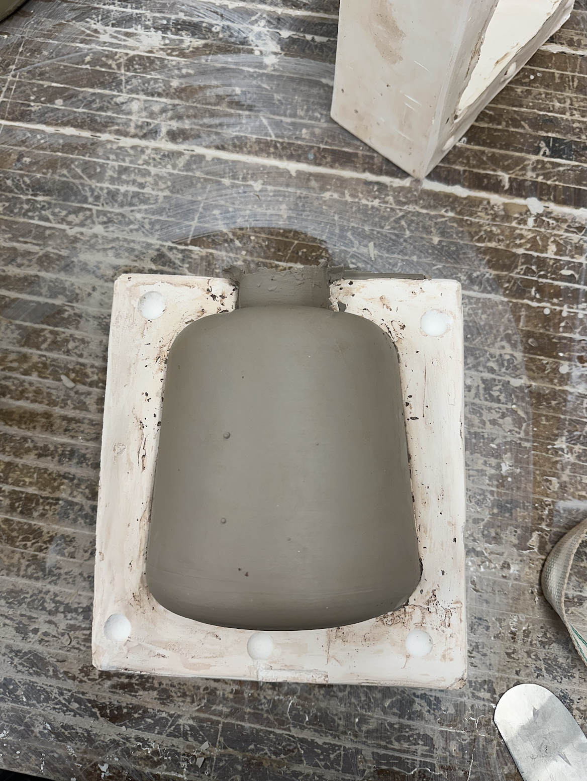 Demolding a slip casted base