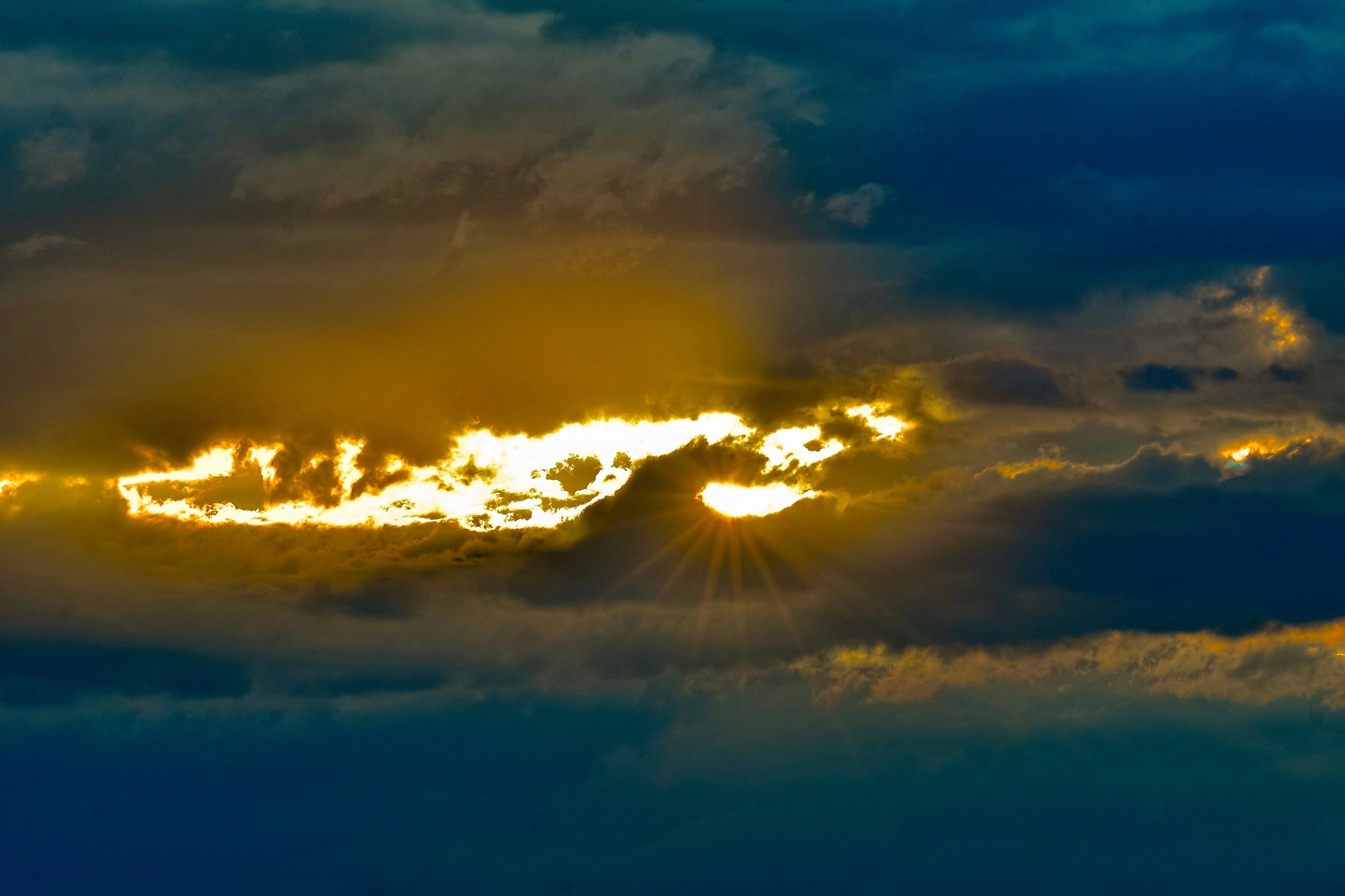 Sun breaking through clouds.jpeg