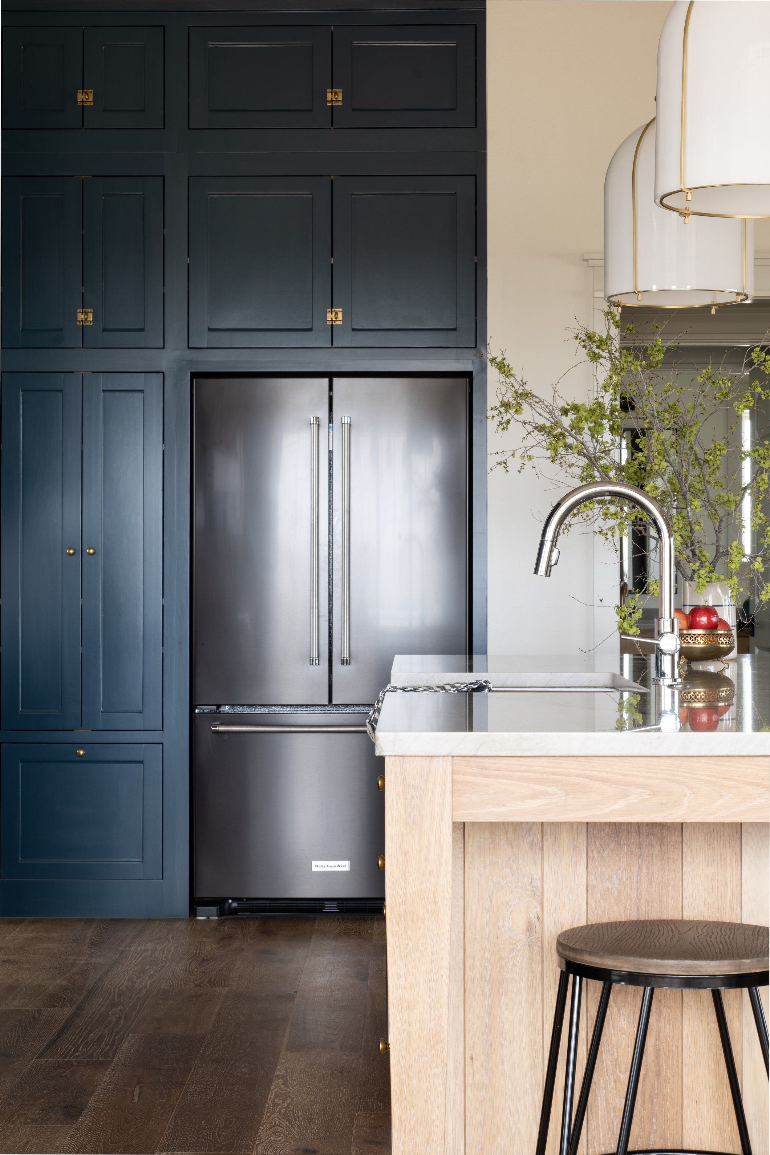 Classic Kitchen with Sherwin Williams Newberg Green Cabinets, KitchenAid refrigerator, and white oak island. 