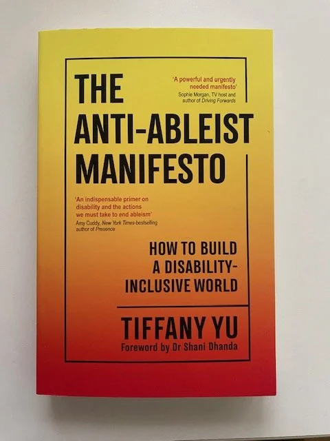 Booktitle: Anti-Ableist Manifesto, Tiffany Yu. The bold bookcover represents a flame and creates a spark to read and take action in disability justice.