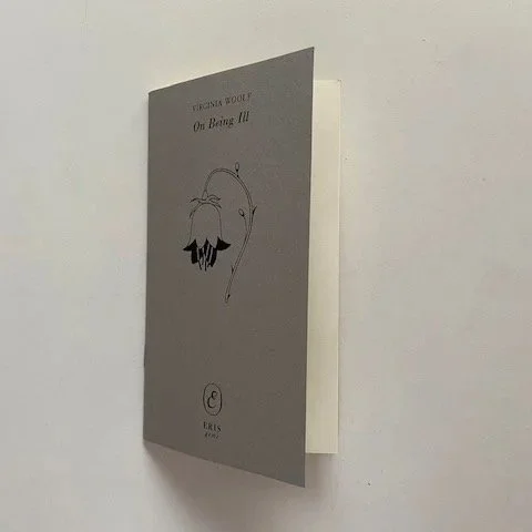 A front cover of the book ‘On being ill’ by Virginia Woolf, author’s name, title and an illustration of a flower.