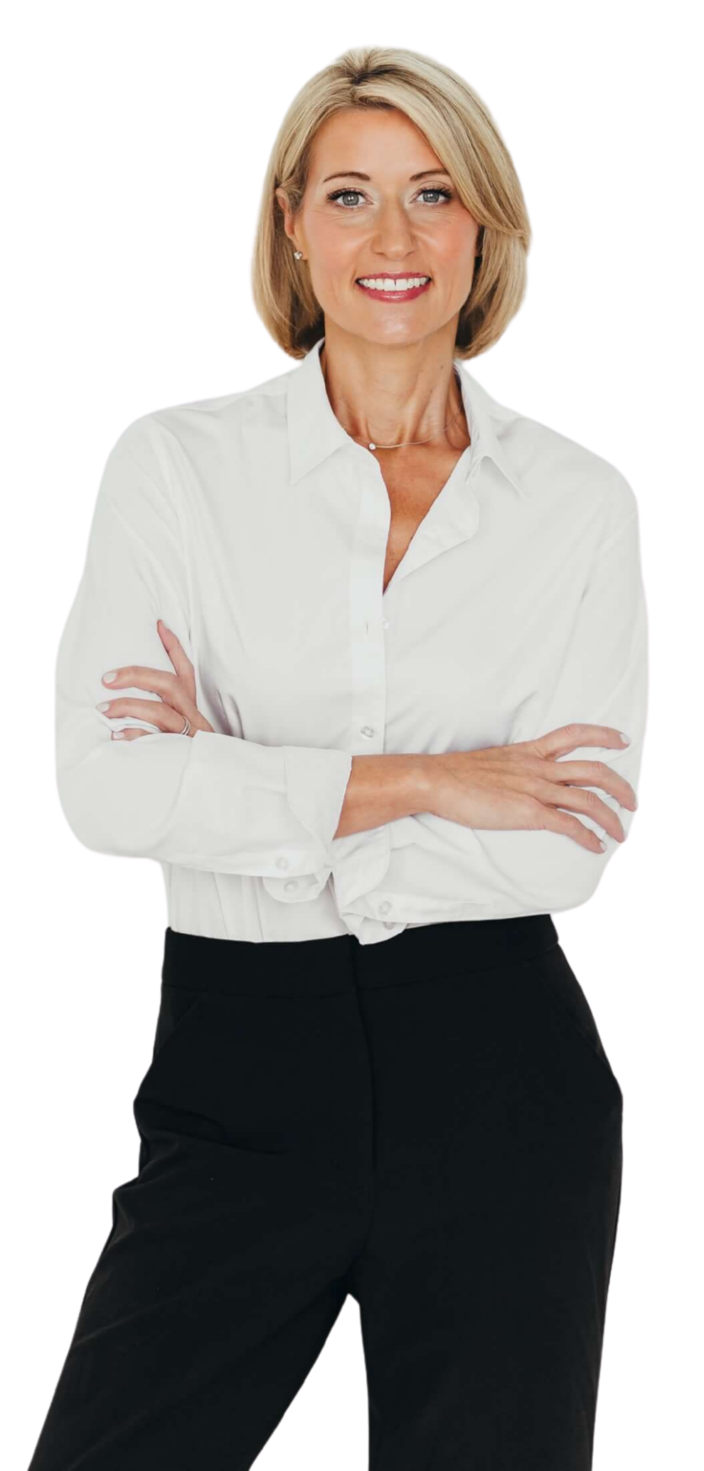Portrait of a professional woman with blonde hair, wearing a white button-up shirt and black pants, smiling with arms crossed.