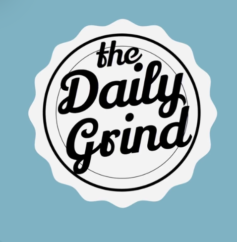 Logo for The Daily Grind with black stylized text inside a circle on a light blue background.