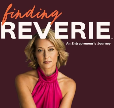 Book cover titled 'Finding Reverie: An Entrepreneur's Journey' with a woman in a pink dress on a dark background.