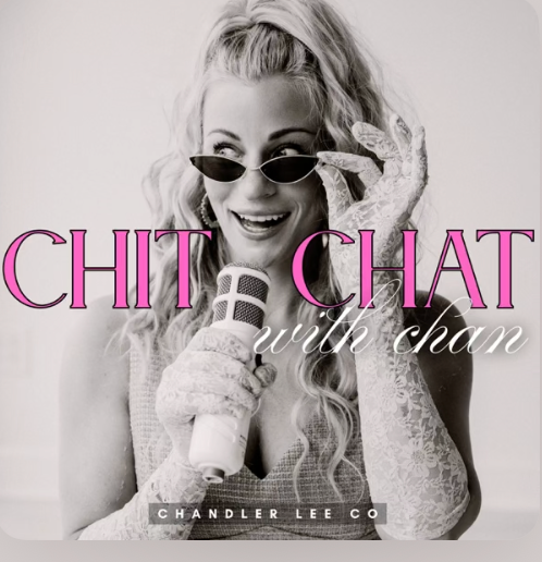 Black and white photo of a woman with curly hair wearing sunglasses, lace gloves, and holding a microphone, smiling. Overlaid pink and white text reads 'Chit Chat with Chan' and a black bar with white text says 'Chandler Lee Co.'.