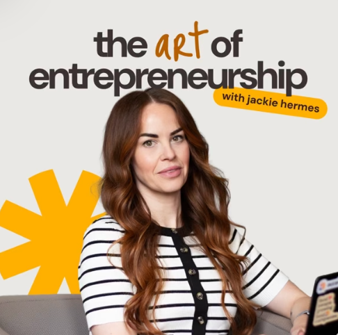 A woman with long, wavy brown hair wearing a striped shirt, sitting and looking at the camera, with text reading 'the art of entrepreneurship with Jackie Hermes' and a yellow stylized sunburst shape in the background.