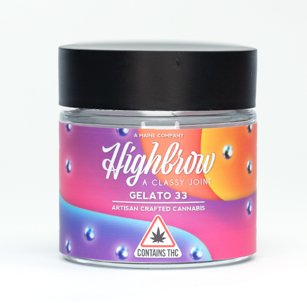 A small glass jar labeled 'Highbrow' with the slogan 'A Classy Joint.' The label features a colorful gradient background with purple, pink, orange, and blue colors, and includes a warning sign 'Contains THC' with a cannabis leaf symbol. The jar contains artisan crafted cannabis called 'Gelato 33' and has a black lid.