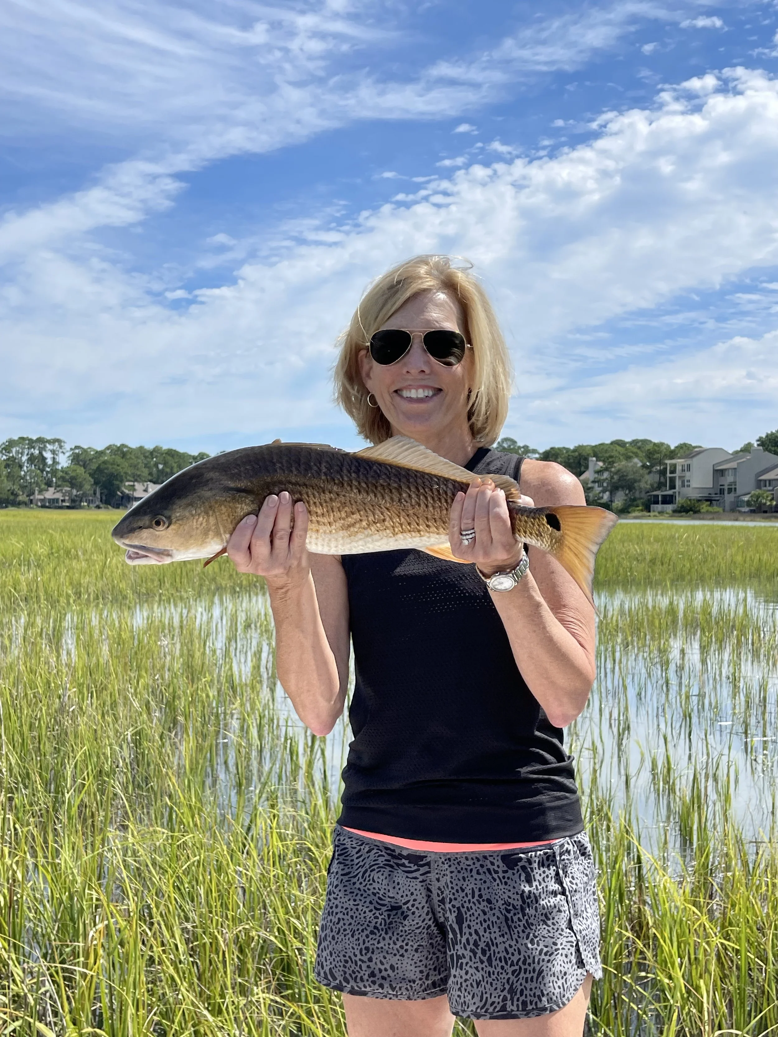 sight fishing for tailing redfish in the grass