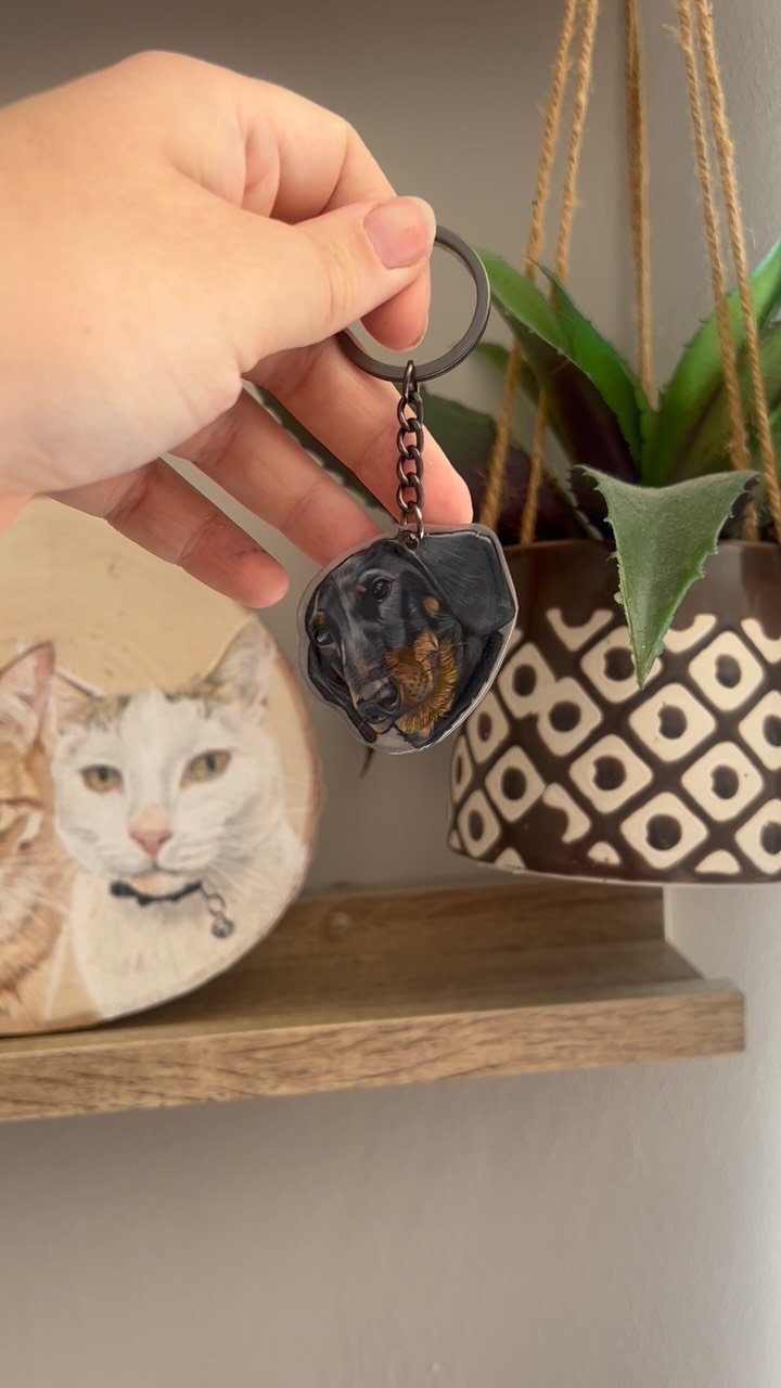 Making a pet portrait keychain using shrink plastic (or shrinky dinks!)
I draw on the rough side using coloured pencil like my usual portraits, cut it out, bake it for a minute or two until it shrinks fully and then I add some UV resin and a keychai