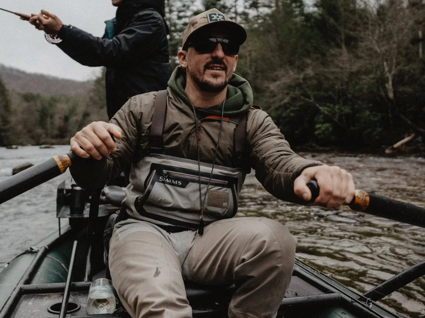 Zac Brooks rowing a raft on the Toccoa River in Blue Ridge, Ga on a guided fly fishing trip.
