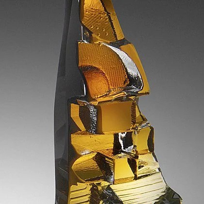 Stacked honey gold hand blown and cast glass creating two vertical forms that are topped off with brass candle holders, by award winning master craftsman Michael Mikula, of Cleveland Ohio-003.JPG