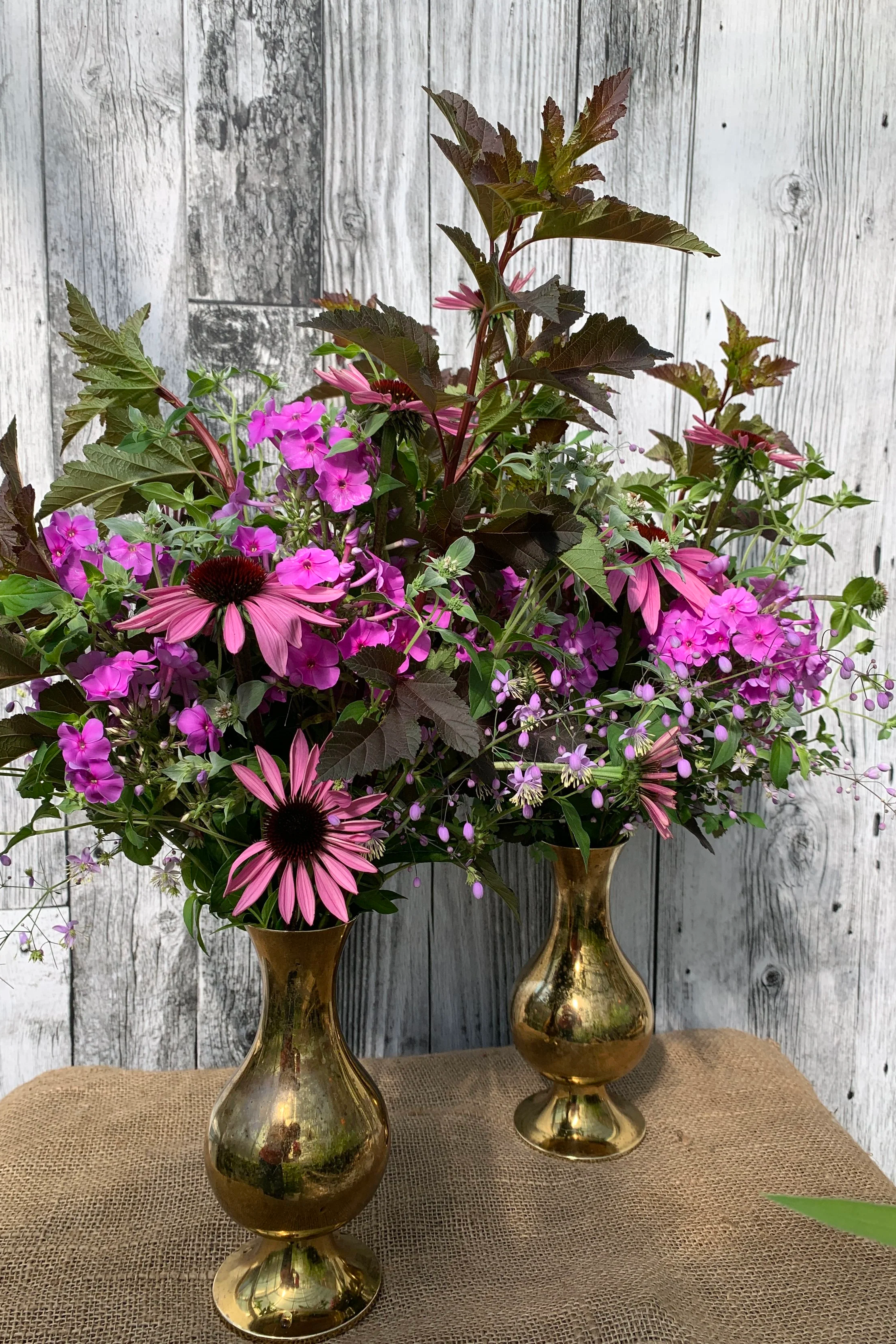 large late summer arrangements in brass vases