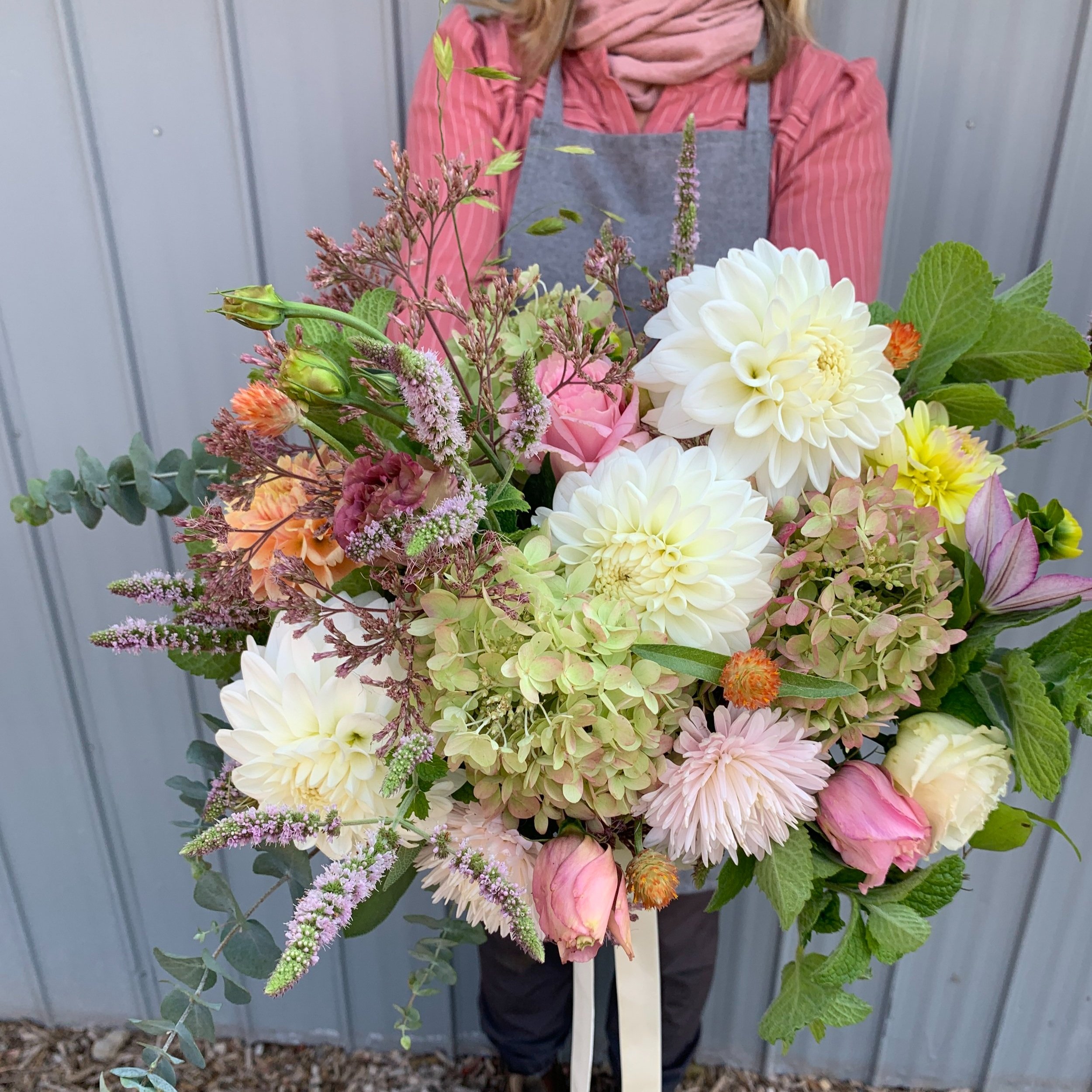 August wedding bouquet with dahlias and field grown flowers