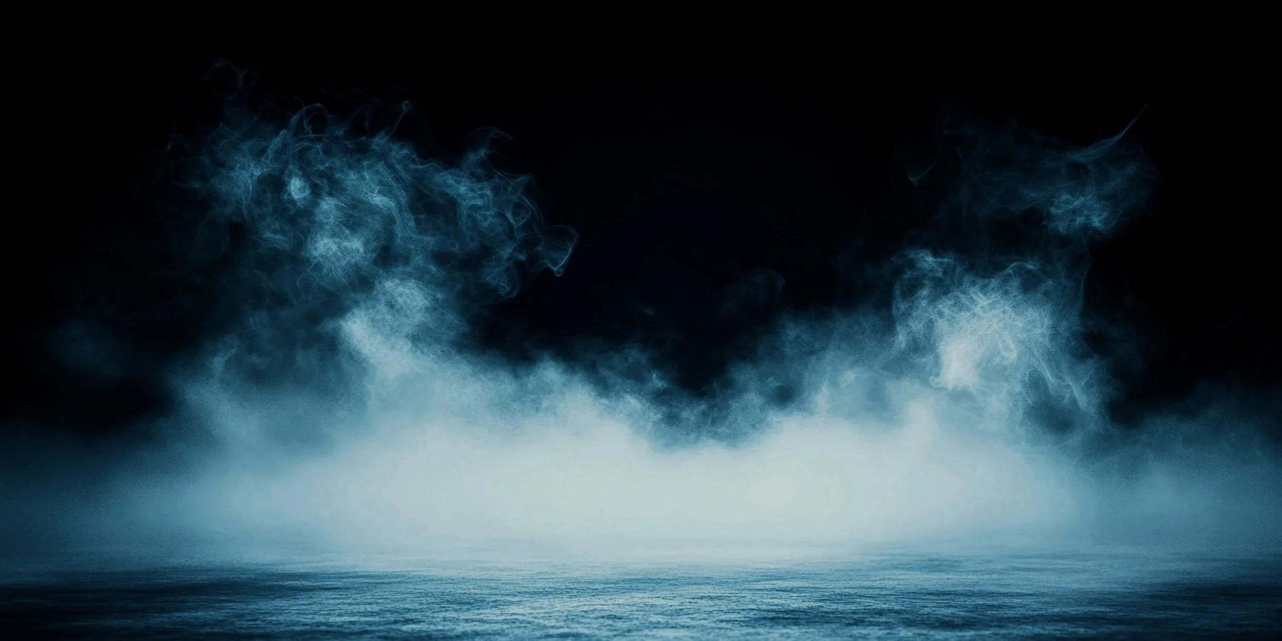 vecteezy_blue-smoke-on-a-dark-background_65496193.jpg