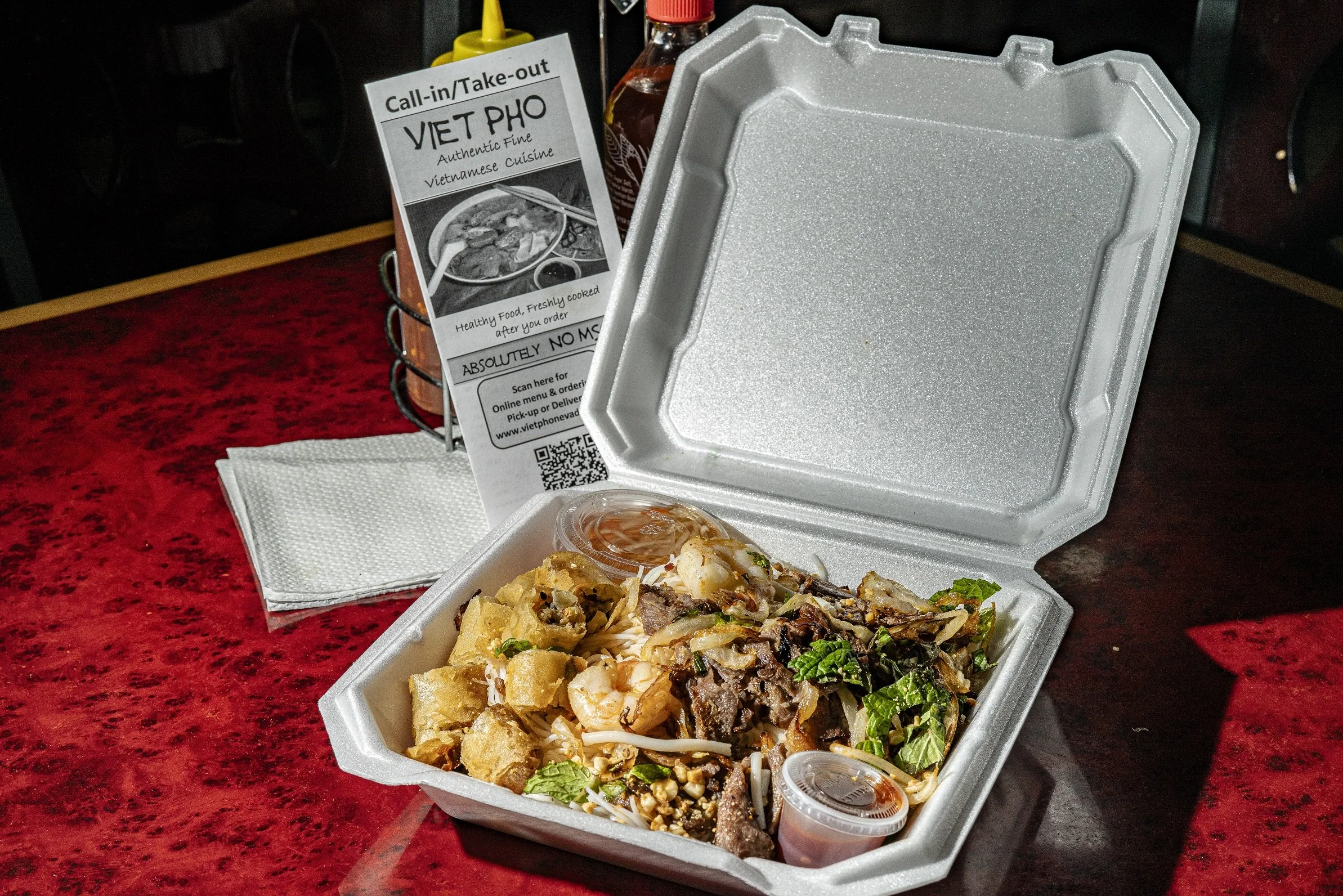 Takeout box with Viet Pho Reno cuisine