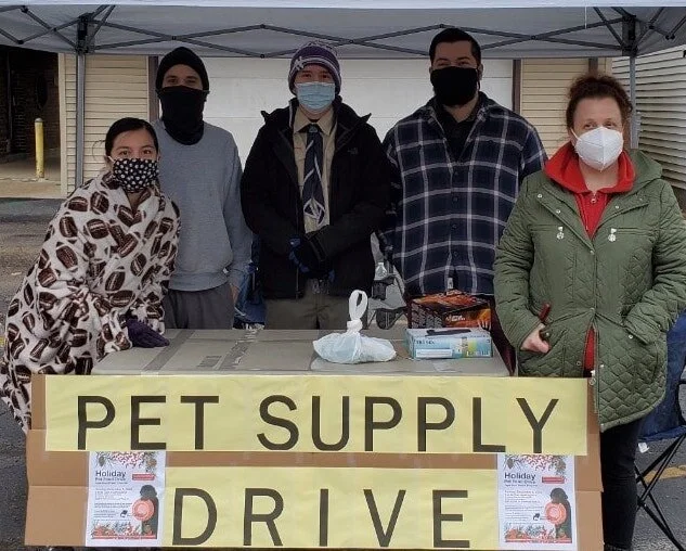 Volunteers posing for a picture at Pet Supply Drive.