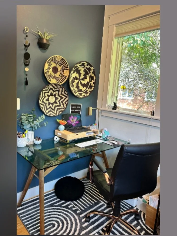 AFTER: We painted just the two sections of wall that were visible from Zoom calls in this closet, decorated with baskets from the owner's travels to Kenya and Malawi, with a glass desk to take up less visual space. With this prientation the owner can
