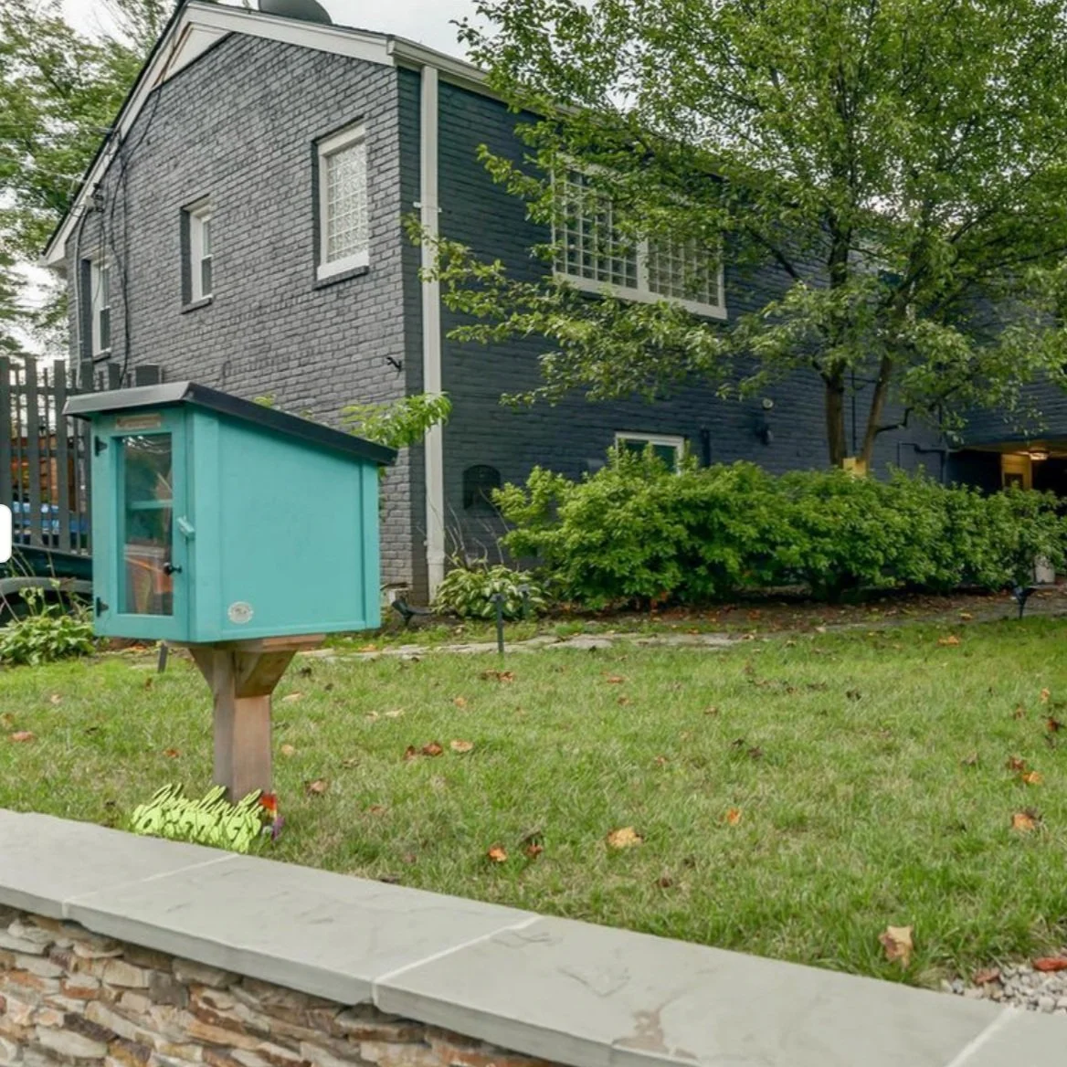 AFTER: river rock wall bottom left, house color 