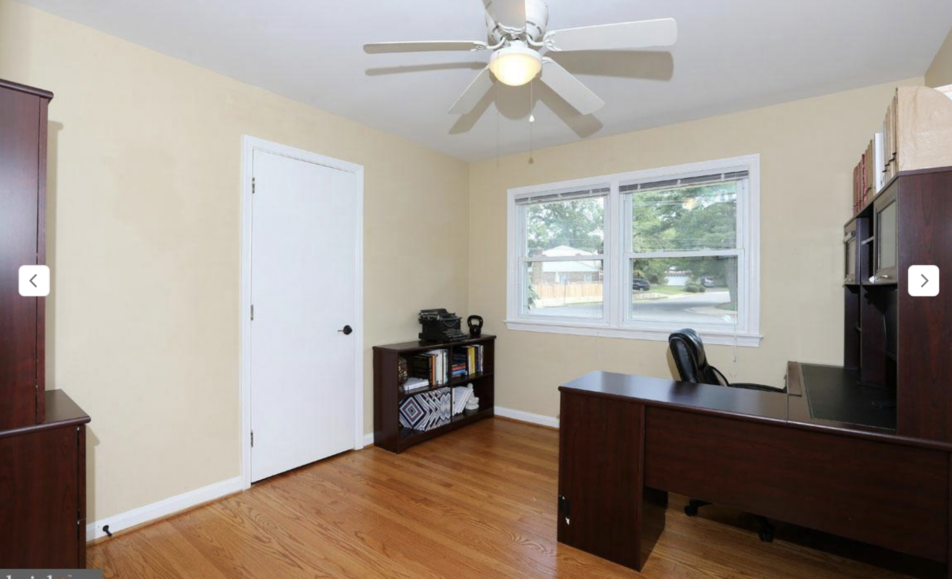 BEFORE: The third bedroom was being used as a home office. The light walls and dark furniture are too harsh a contrast, and this type of office-grade furniture does not belong in a home. 