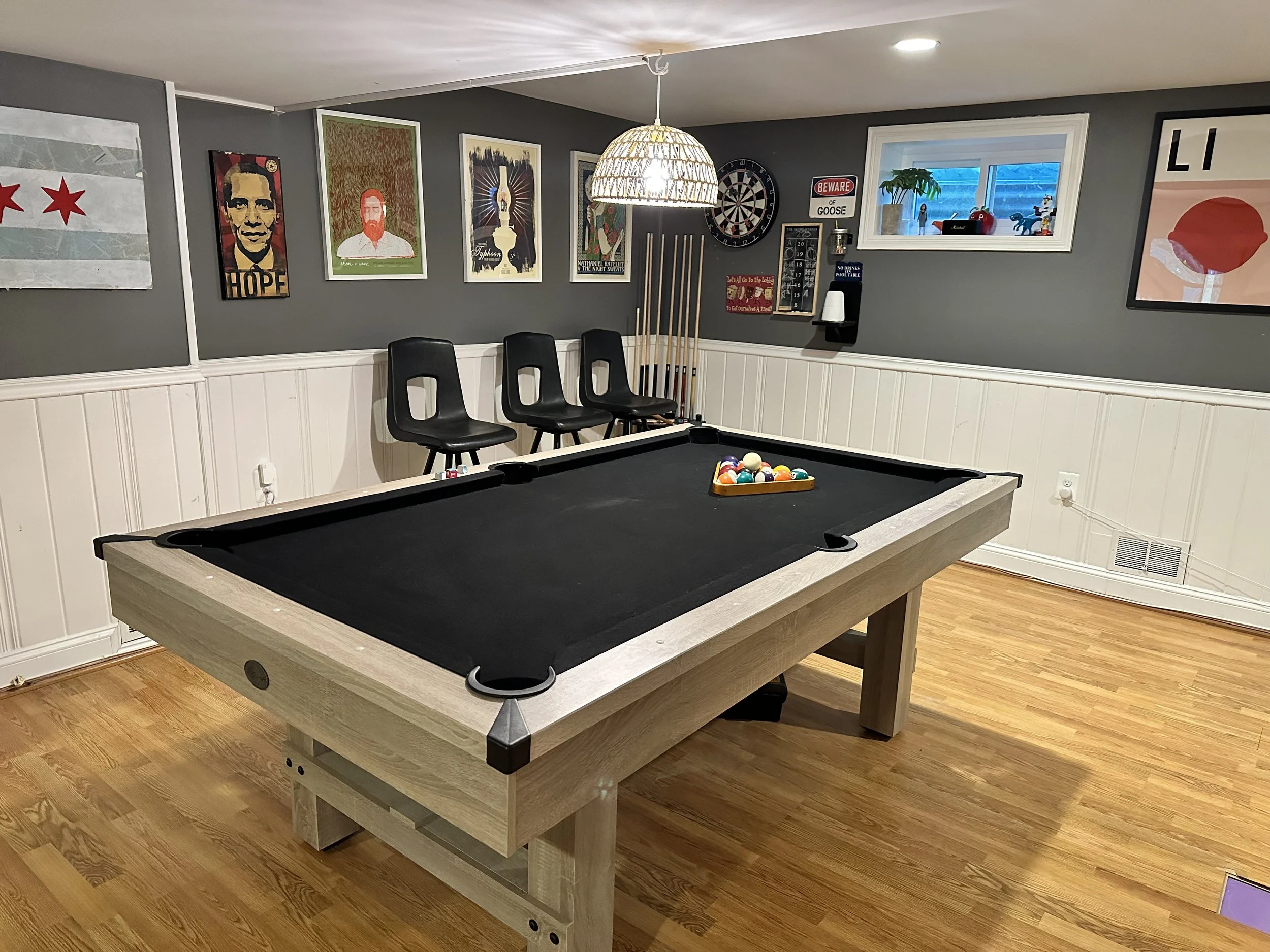 AFTER: a dank and creepy basement is now a viable recreation room for the whole family