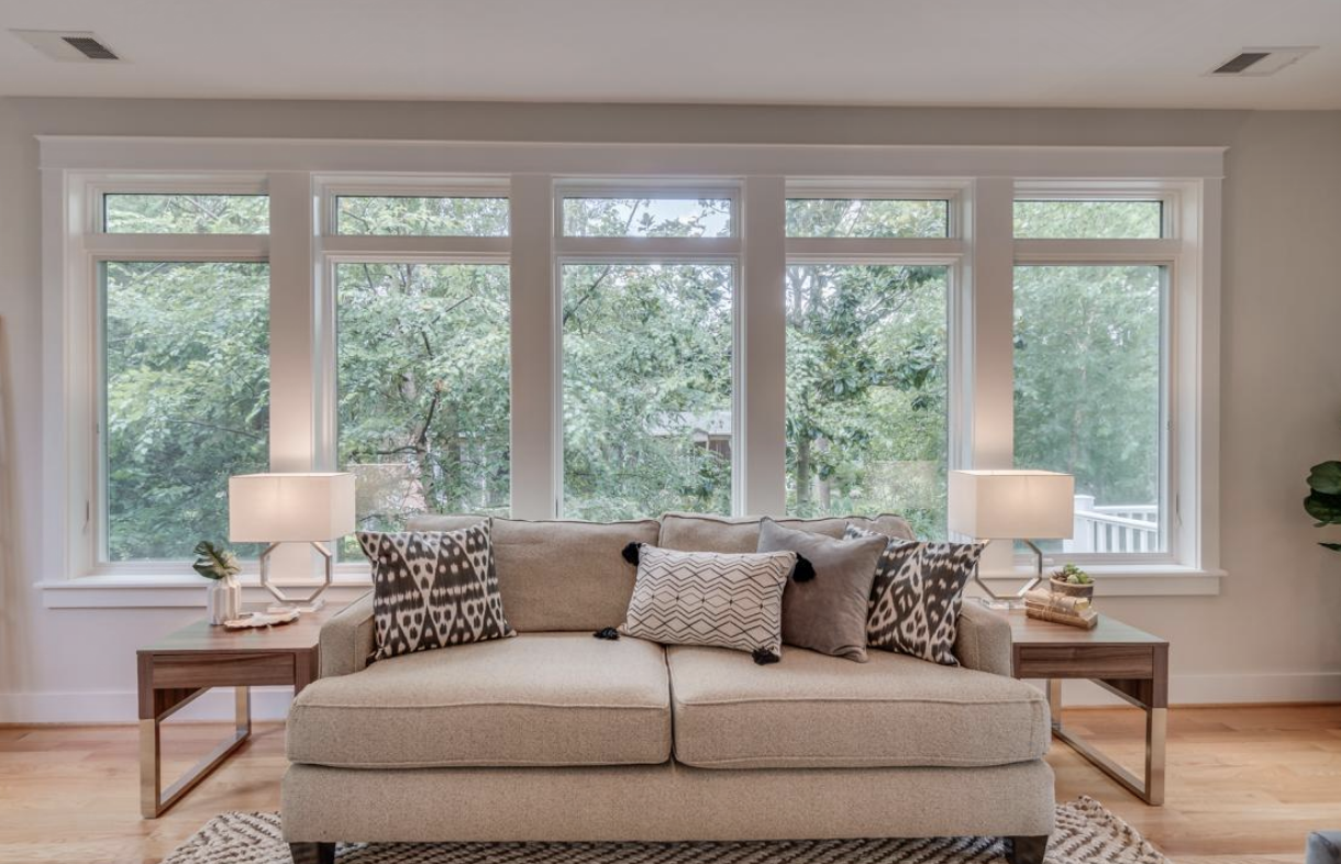 BEFORE: this couch is the wrong scale for this big room with high ceilings 