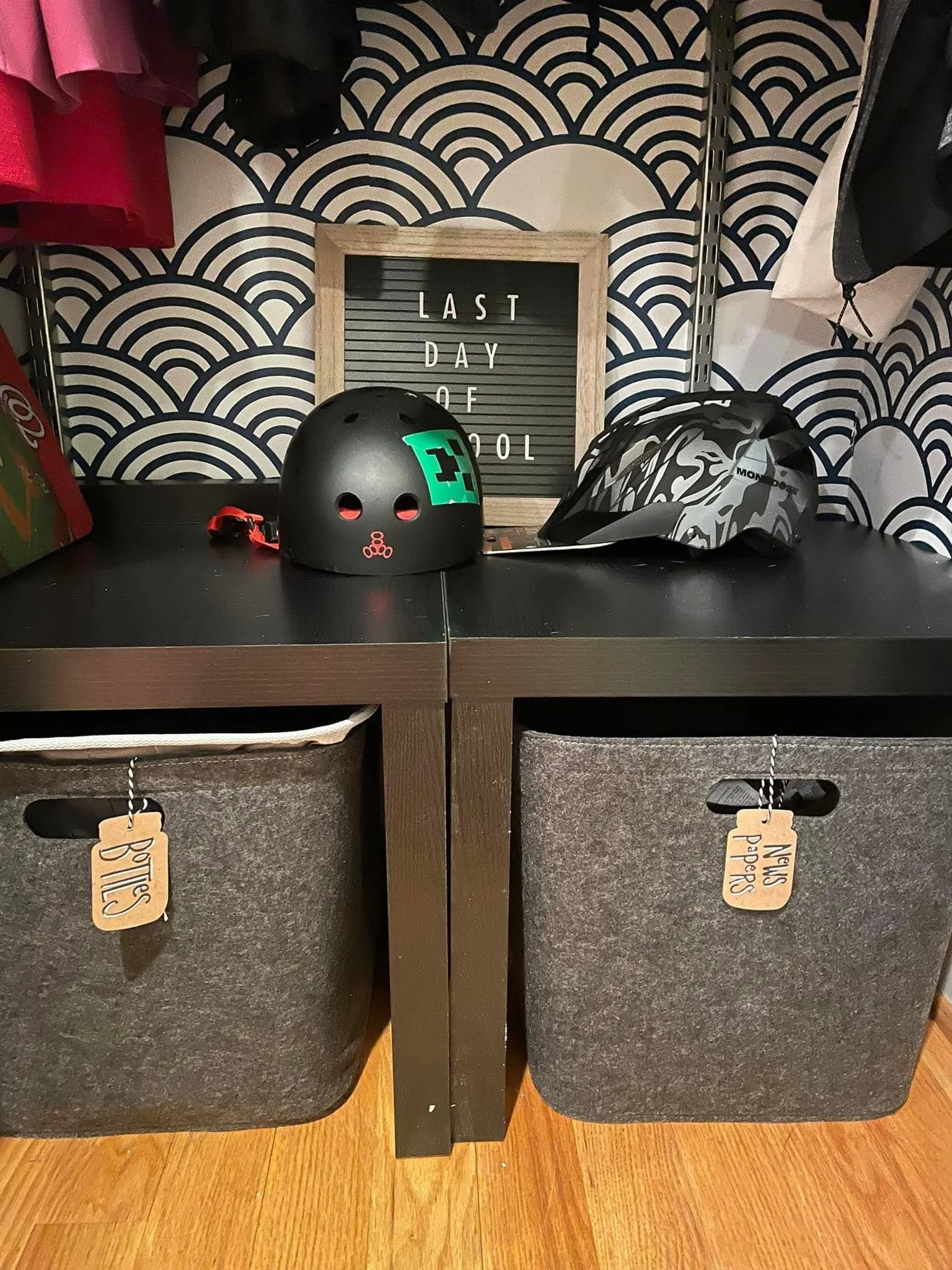 Two cheap tables from Amazon fit perfectly in the bottom of the closet to hack a storage cubby solution the perfect size for two big felt bins from Target. Bottles for recycling on the left, newspapers on the right (note: the felt bin is the perfect 