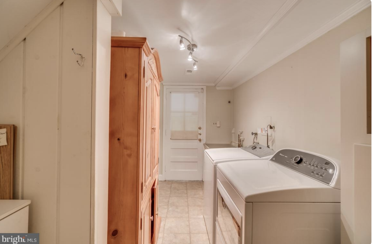 BEFORE: Adult humans spend way too much time doing laundry to be sad in those spaces. That said, this is a basement, so the homeowner (me) didn't want to spend a lot of money on this little makeover. We got the junk guys to haul away the giant wardro